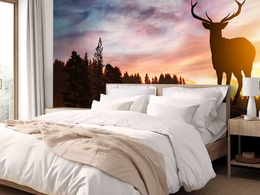 Jeleń z zachodem słońca