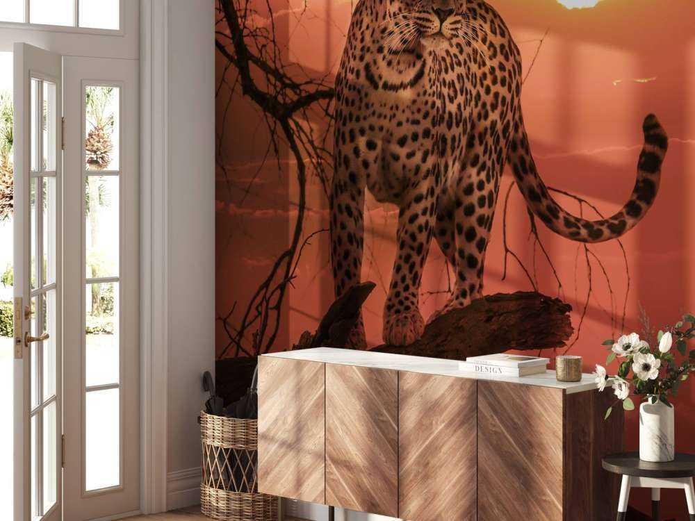 Lampart na tle zachodzącego słońca