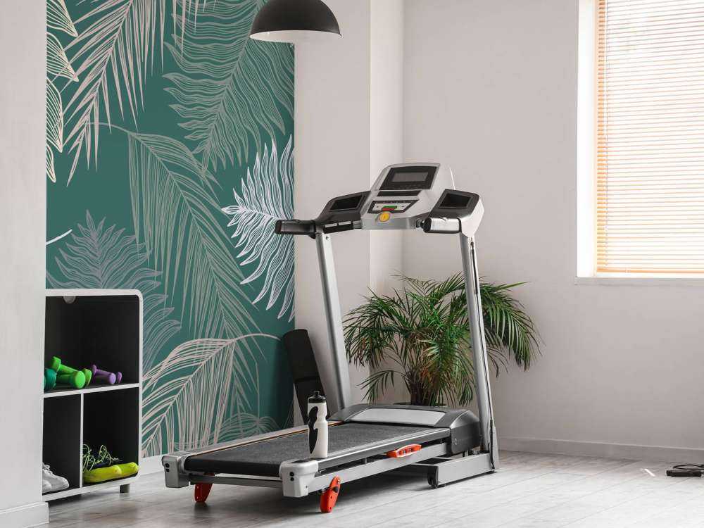 Liść palmowy na zielonym tle