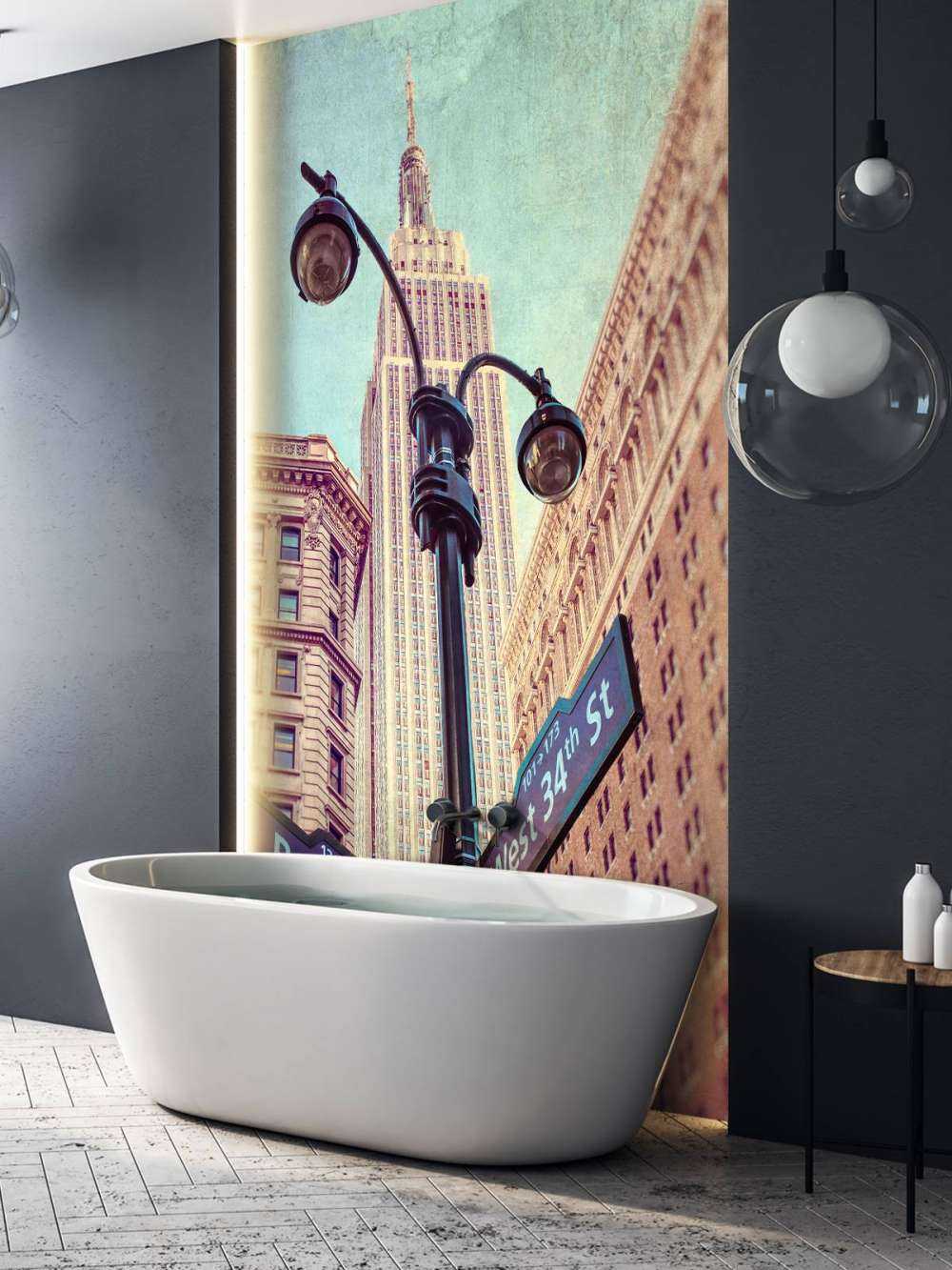 Street lamp and street signs with Empire State building in background - New York