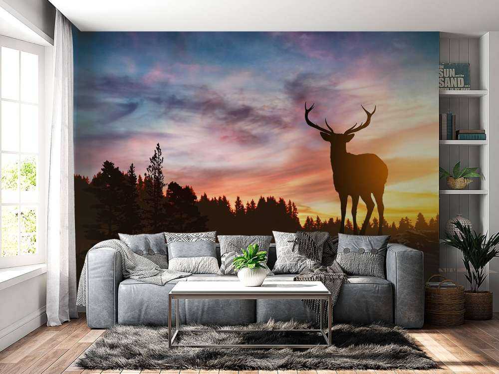 Jeleń z zachodem słońca