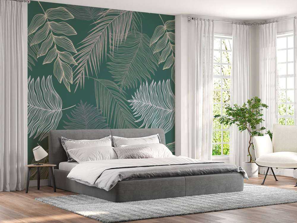 Liść palmowy na zielonym tle