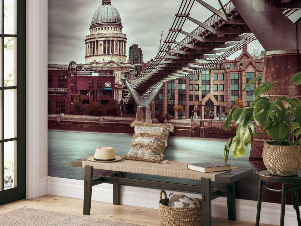 View of St Paul's Cathedral and Millennium Bridge from river thames, London, UK
