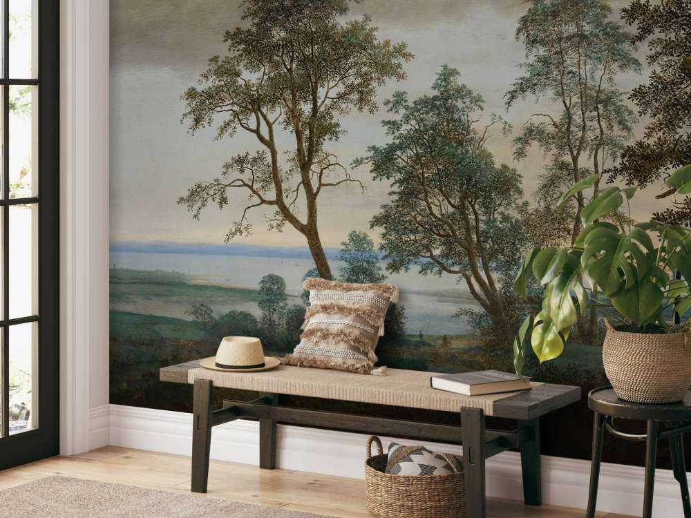 Krajobraz rzeczny widziany przez drzewa