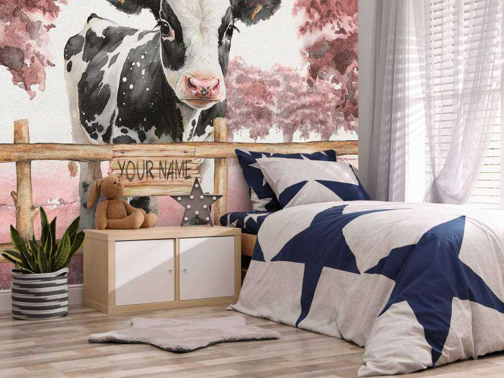 Młoda krowa na łące różowa