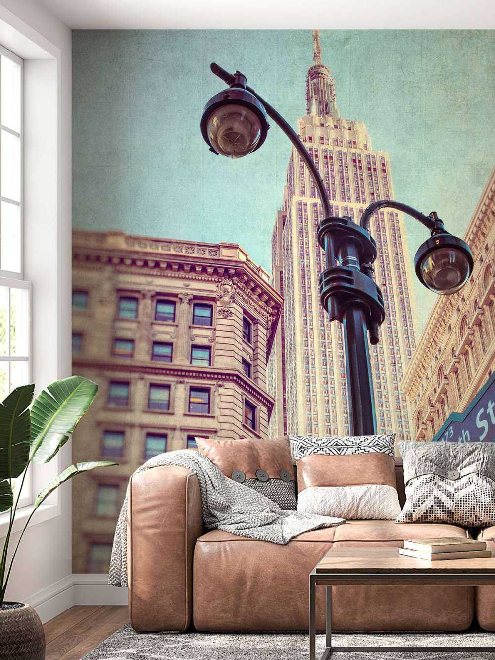 Street lamp and street signs with Empire State building in background - New York