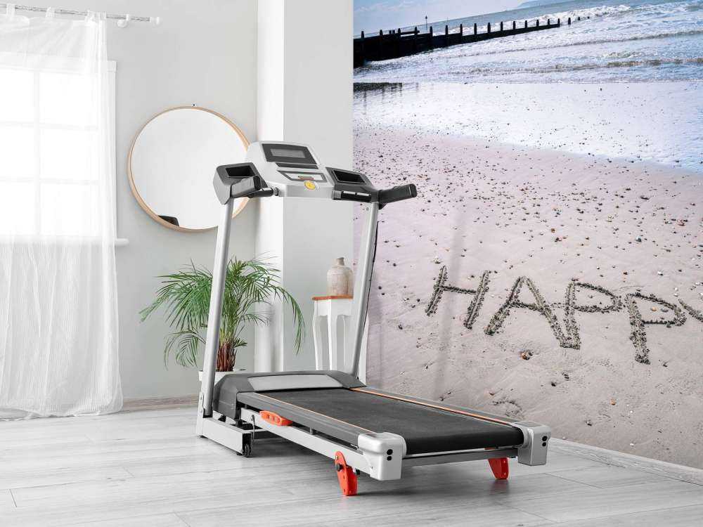 HAPPY message written in smooth sand at the beach