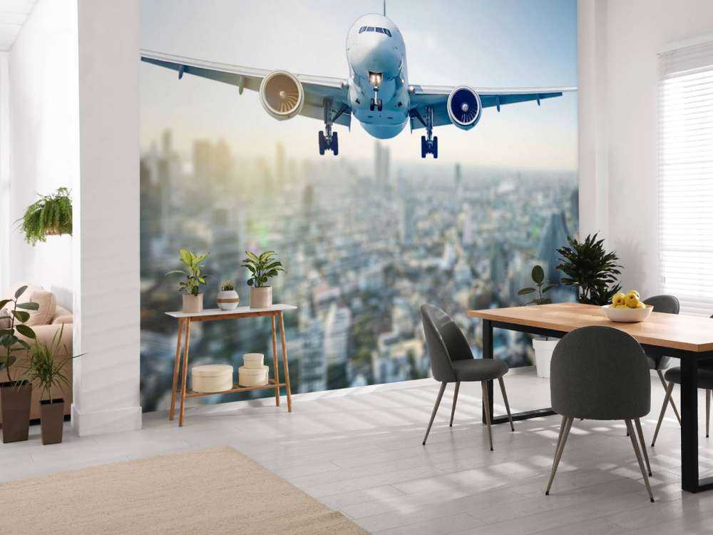 Zlatujący się samolot nad miastem