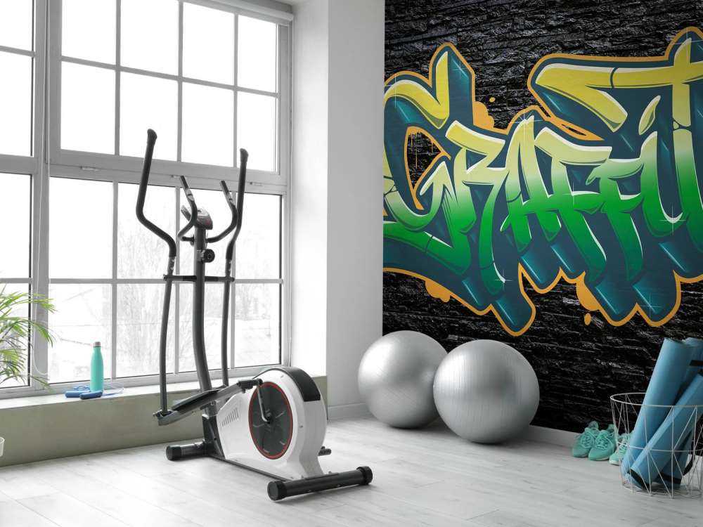 Graffiti na ścianie z czarnej cegły